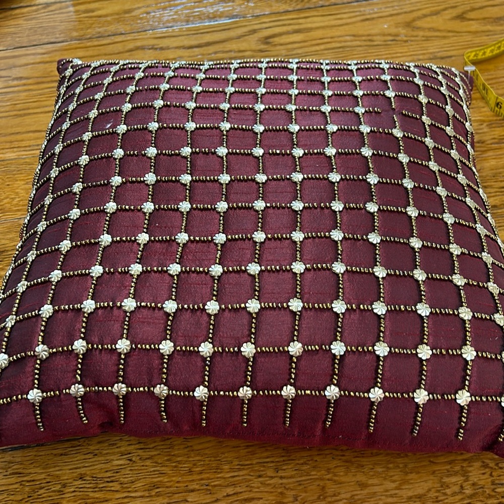 Pier 1 wine accent pillow with beaded details in gold.  Some beads missing. 16”.